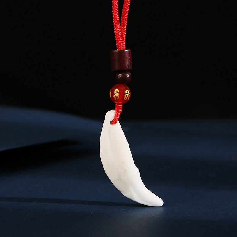 Roaring Sky Dog Black Dog Tooth Pendant