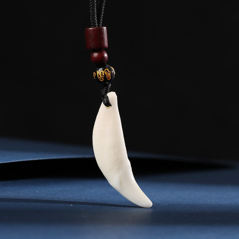 Roaring Sky Dog Black Dog Tooth Pendant